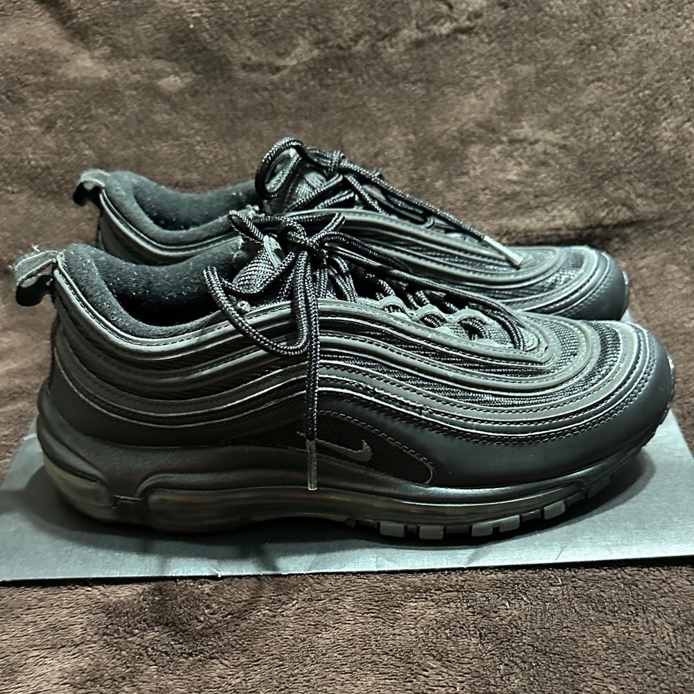 Nike Women’s Triple Black Air Max 97 Sneakers with grey accents.